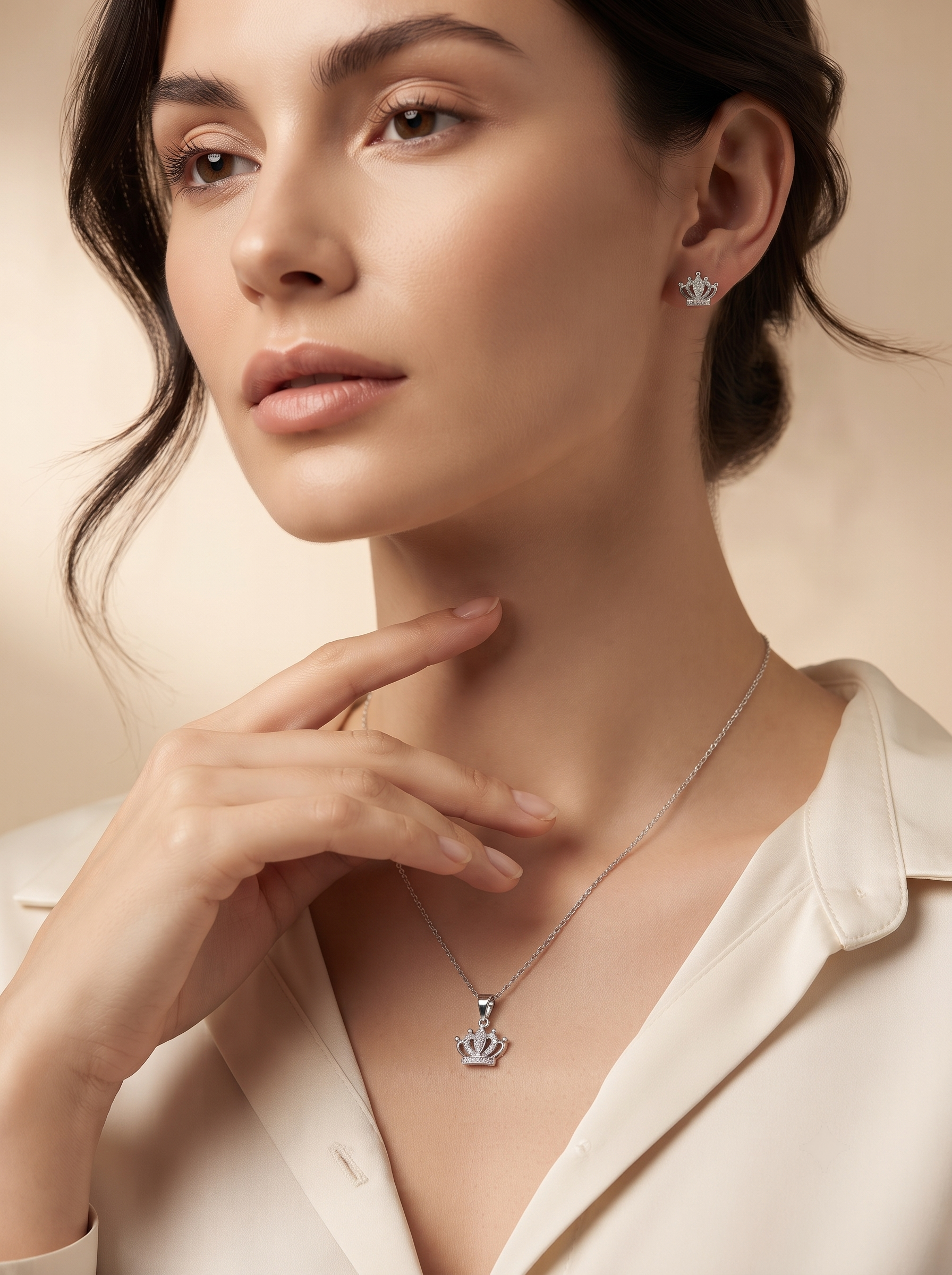 Silvme pure 925 sterling silver crown pendant and stud earrings set with cubic zirconia, styled lifestyle image