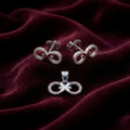 Silvme 925 silver ribbon bow pendant and stud earrings with cubic zirconia, close-up detail