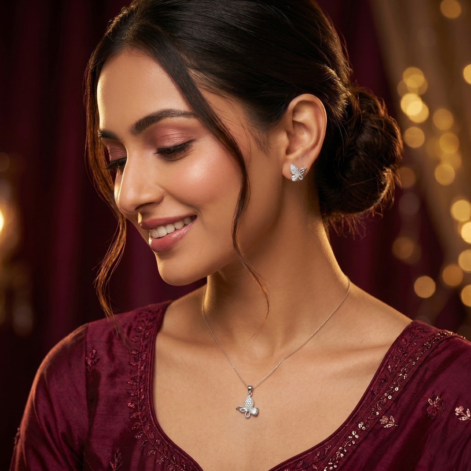 Silvme 925 silver pink butterfly pendant and stud earrings with pink cubic zirconia, close-up detail