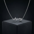 Detailed heartbeat pendant styling on the Silvme Heartbeat Pendant Necklace in polished 925 silver