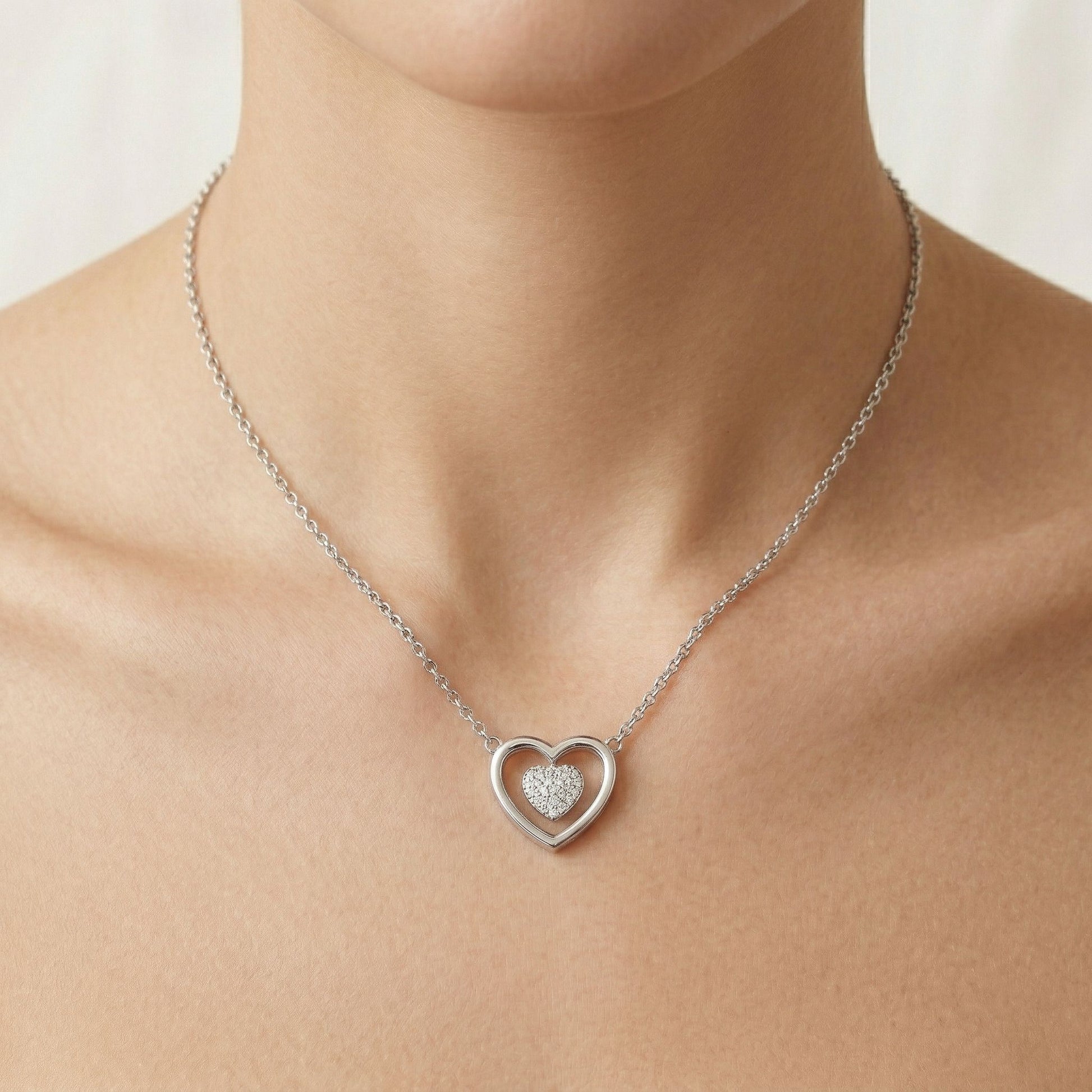 Double Heart design detail on the Silvme Double Heart Pendant Necklace, crafted in polished 925 silver