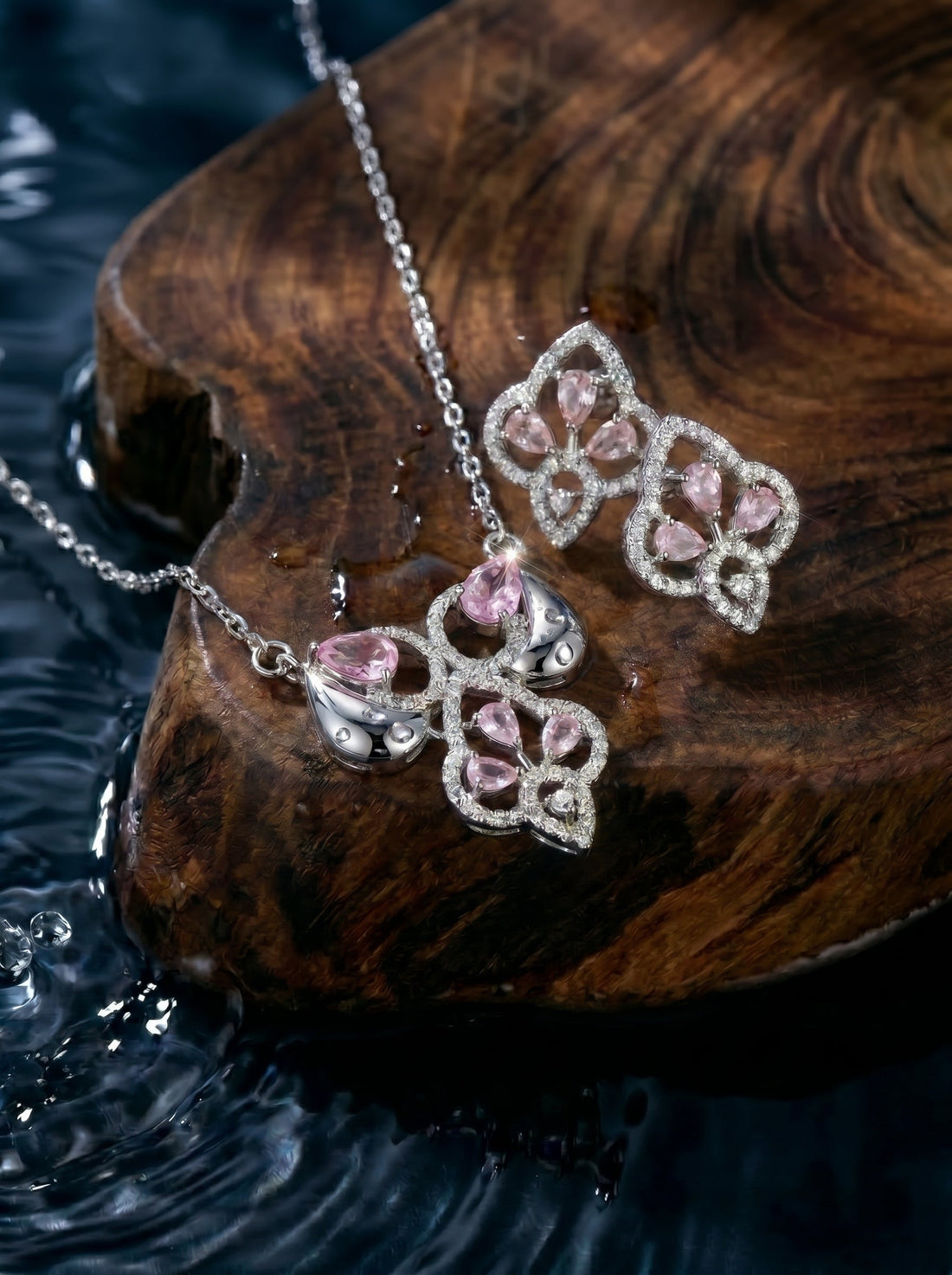Silvme 925 silver pink drop cluster pendant necklace and stud earrings with pink cubic zirconia, side profile view