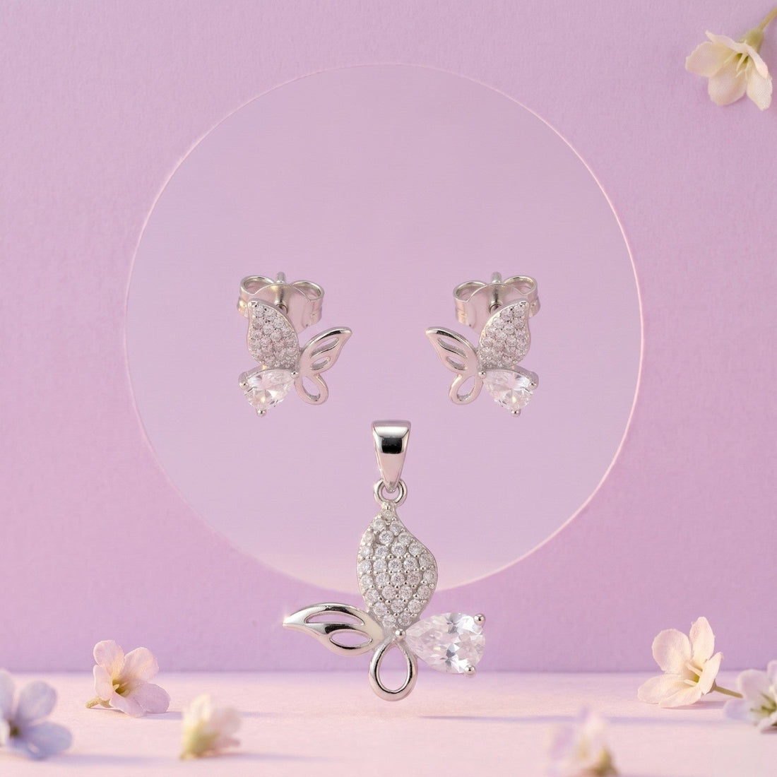 Silvme pure 925 sterling silver pink butterfly pendant and stud earrings set with pink cubic zirconia, front view on white background