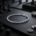 The twisted rope chain bracelet for men shown against a plain studio background