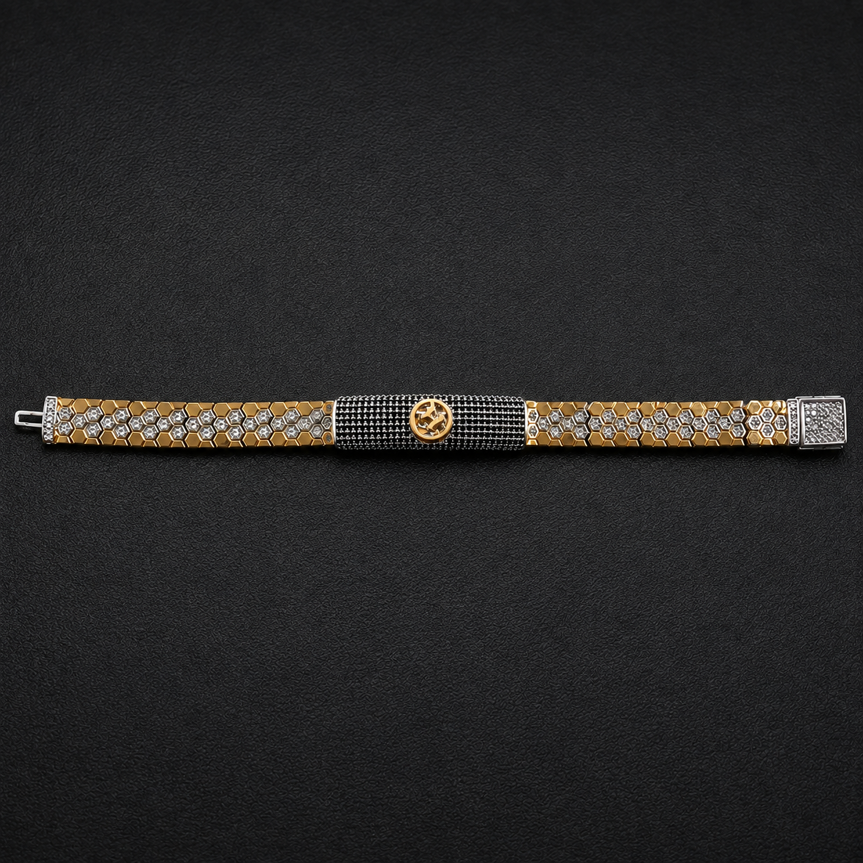 Full length of the black pave panel statement bracelet showing its black and gold-tone with silver finish
