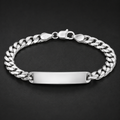 Full length of the curb chain id bracelet showing its polished silver-tone finish