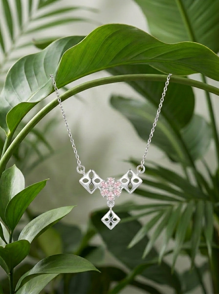 Geometric Pink 925 sterling silver pendant necklace and stud earrings jewellery set with pink cubic zirconia by Silvme â€” styled view