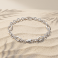 Full length of the oval station rolo bracelet showing its polished silver-tone finish