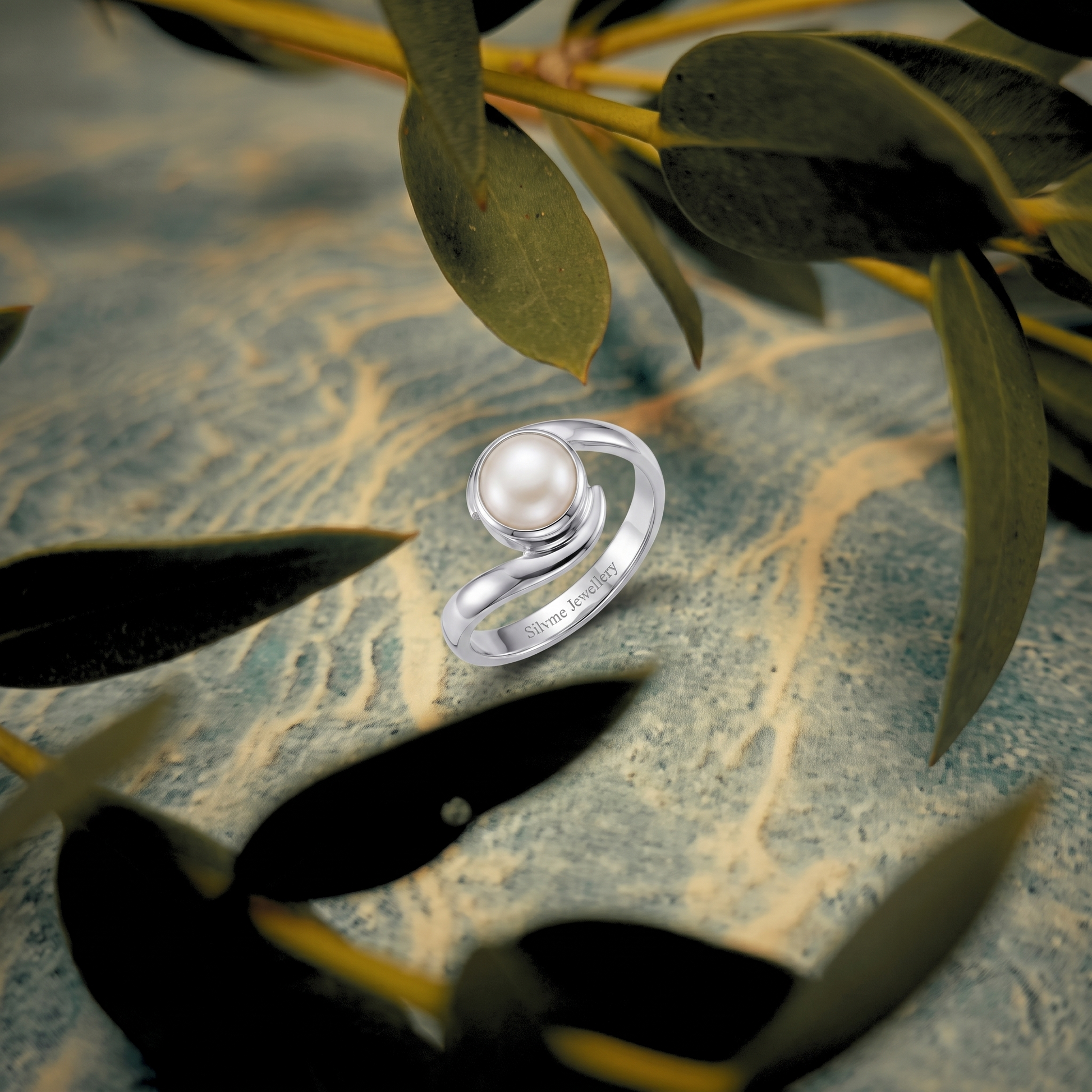 Close-up of the round pearl framed by crossover silver waves, Silvme 925 sterling silver pearl wave bypass ring for women