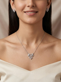 Silvme pure 925 sterling silver ornate petal pendant necklace and stud earrings set with cubic zirconia, front view of the complete set