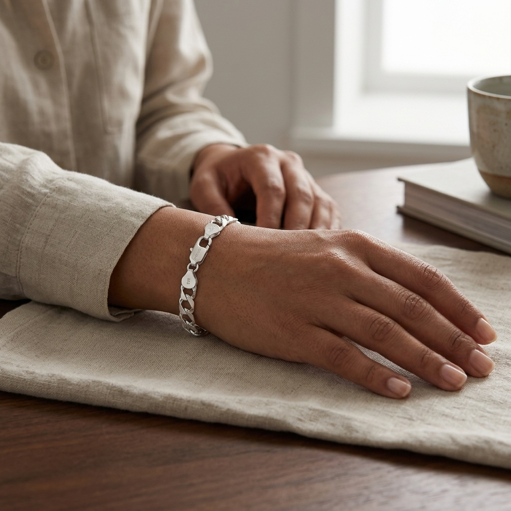 The wide curb chain bracelet for men shown against a plain studio background