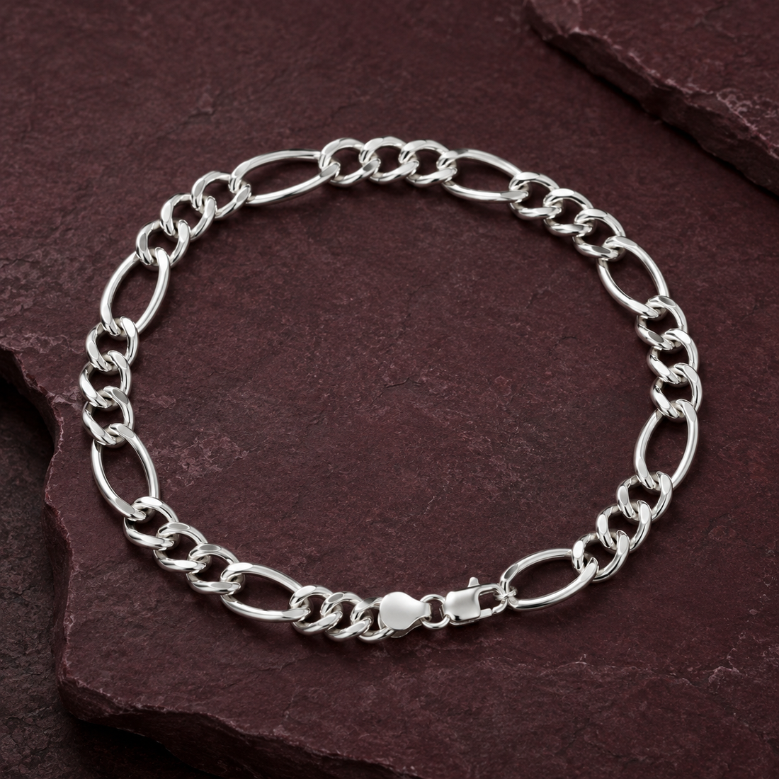 Silvme 925 sterling silver figaro chain bracelet for men shaped into an oval on a white background