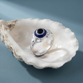 Close-up of the round blue evil eye nazar motif, Silvme 925 sterling silver evil eye ring for women