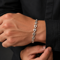 Close-up of oval mariner links crossed by a centre bar down the full length on the Silvme mariner link bracelet