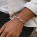 The textured rolo chain bracelet for men shown against a plain studio background