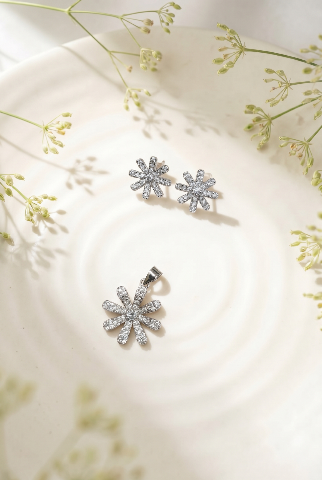 Silvme pure 925 sterling silver floral flower pendant and stud earrings set with cubic zirconia, front view on white background