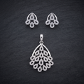 Silvme pure 925 sterling silver sparkling cubic zirconia pendant and stud earrings set with cubic zirconia, styled flatlay view