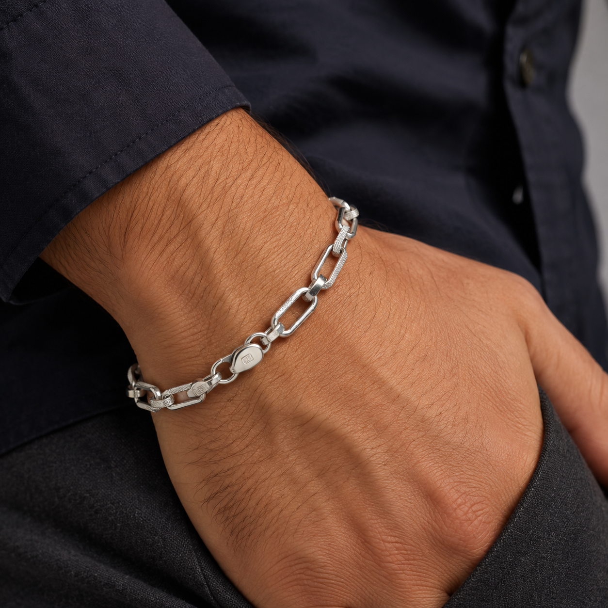 Full length of the textured paperclip link bracelet showing its textured silver-tone finish