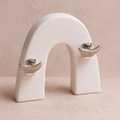 Crescent 925 silver stud earrings for women, office wear, styled flat lay