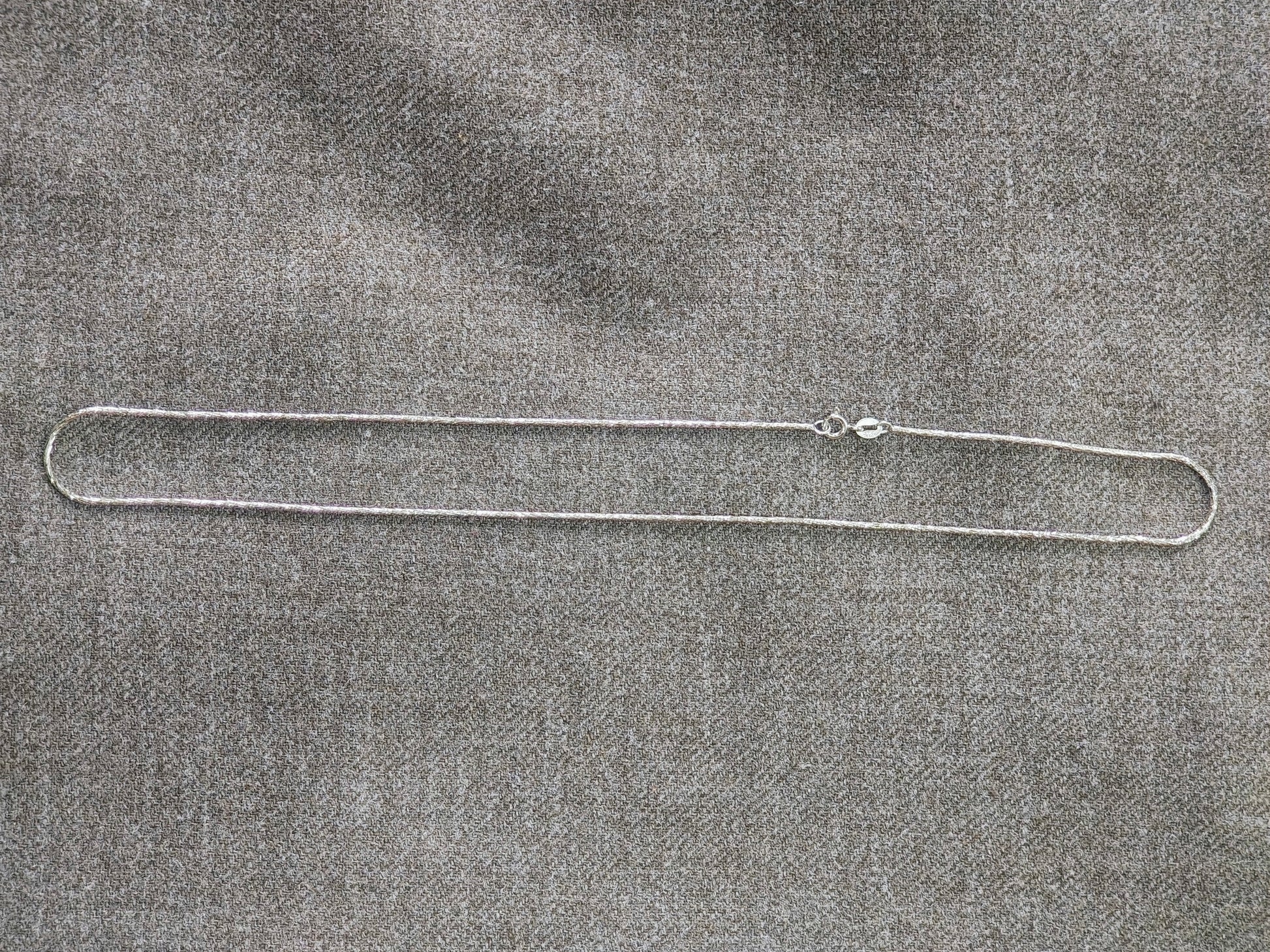 925 sterling silver rhodium-plated chain by Silvme, weighing about 5.05 g, clasp included