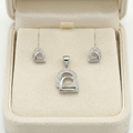 Silvme 925 silver minimalist arch pendant and stud earrings, lifestyle gift image