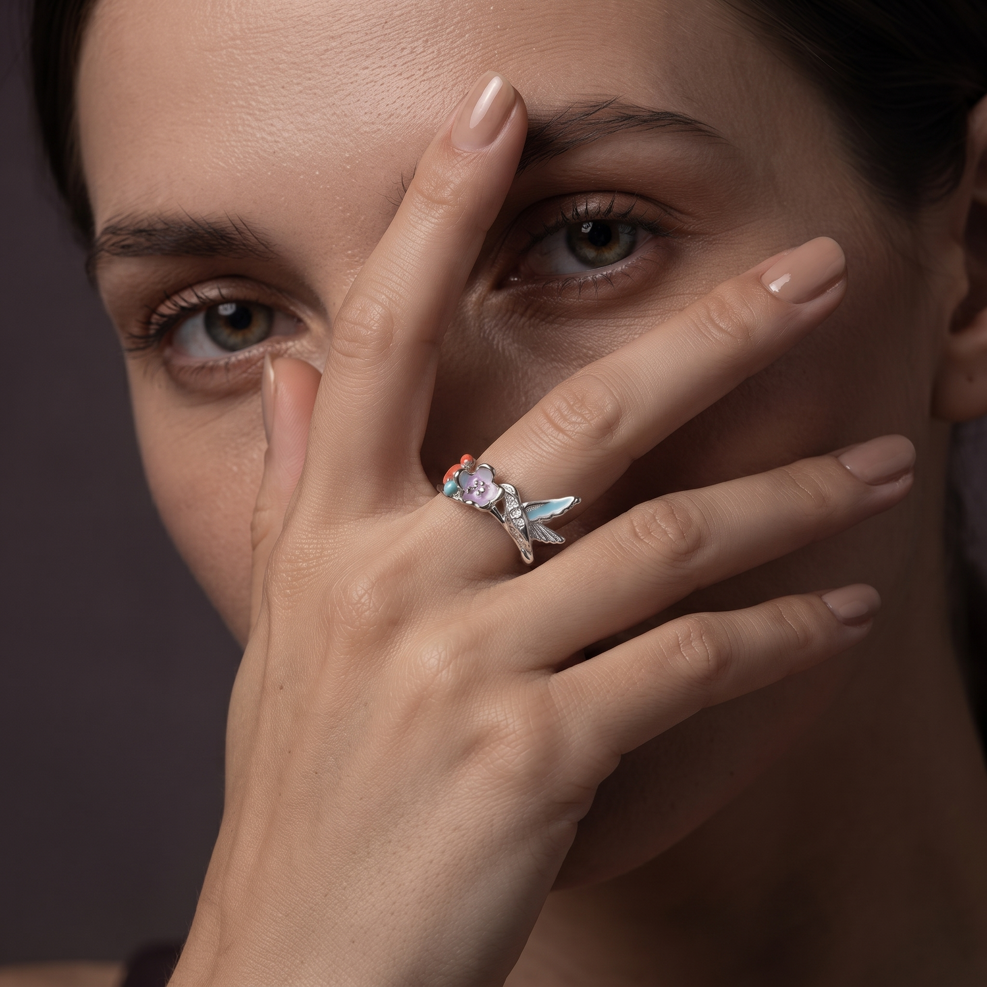 Silvme hummingbird flower silver ring for women worn stacked with plain silver bands on the hand