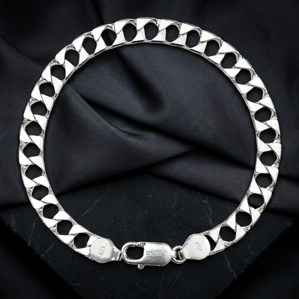 Close-up of a broad flat curb chain built for real presence on the wrist on the Silvme wide curb chain bracelet