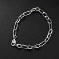 Full length of the elongated figaro bracelet showing its polished silver-tone finish