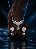 Silvme 925 silver geometric pink pendant necklace and stud earrings with pink cubic zirconia, side profile view