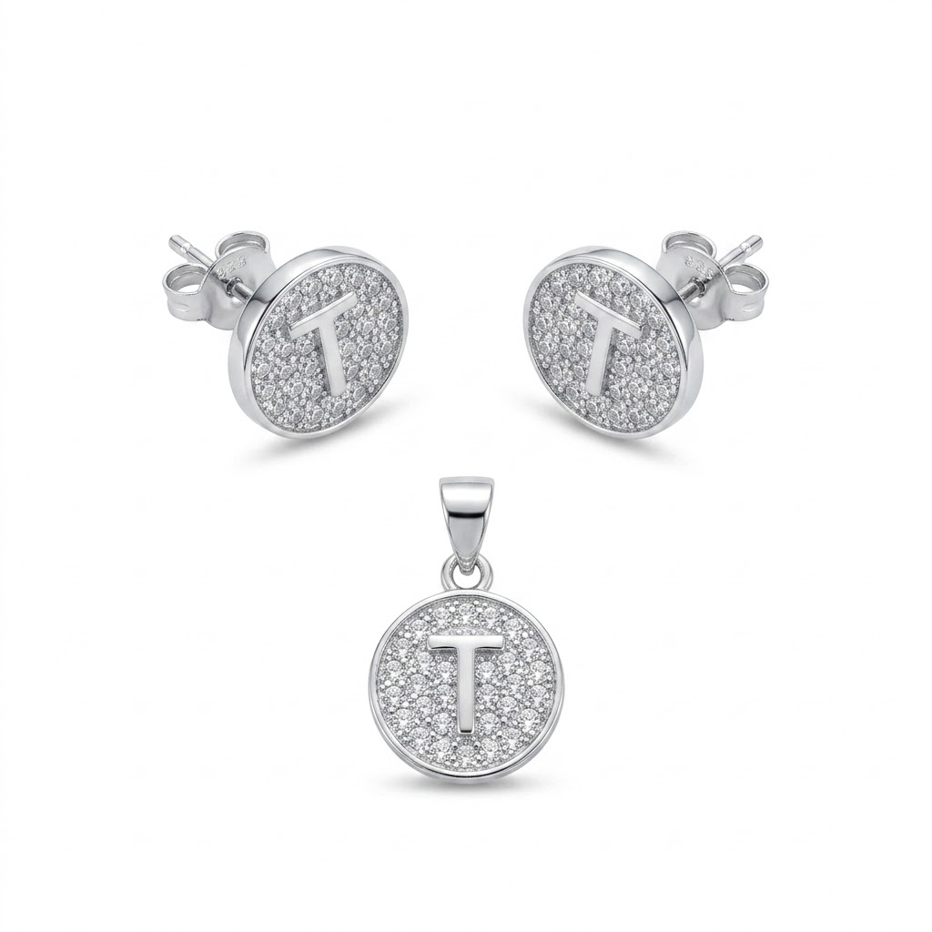 Initial T 925 sterling silver pendant necklace and stud earrings jewellery set with cubic zirconia by Silvme â€” angled studio view