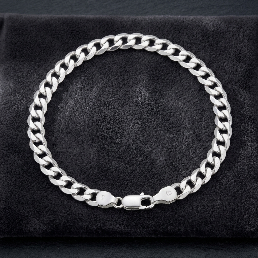 The polished curb chain bracelet for men shown against a plain studio background