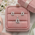 Minimalist Arch 925 sterling silver pendant and stud earrings jewellery set by Silvme â€” styled setting image
