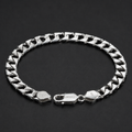 Close-up of a solid flat curb chain with a wide, level face on the Silvme solid flat curb chain bracelet