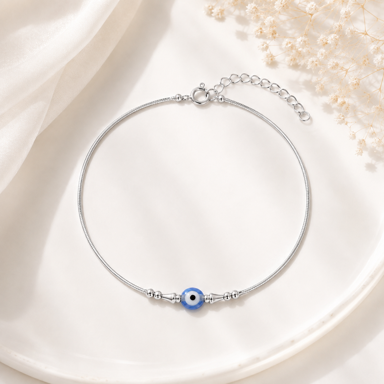 Charm, bead and chain detail on the Silvme single evil eye 925 silver anklet payal