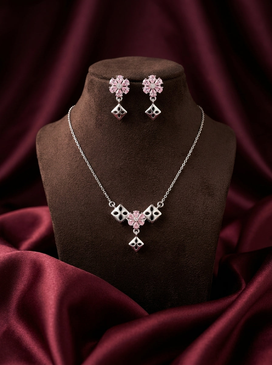 Silvme pure 925 sterling silver geometric pink pendant necklace and stud earrings set with pink cubic zirconia, detail sparkle close-up
