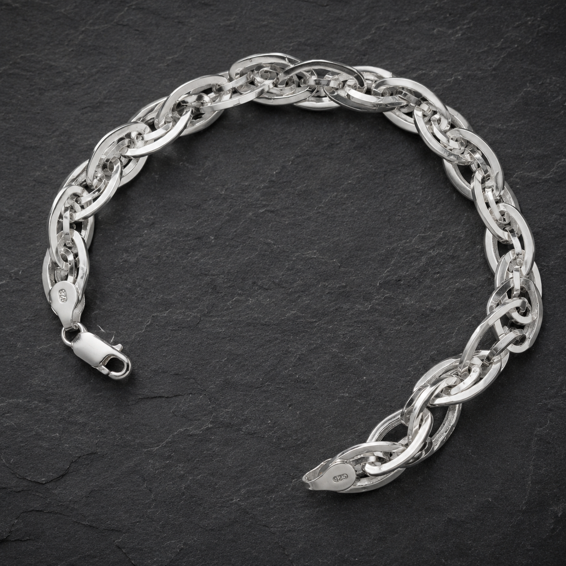 Silvme 925 sterling silver interlocked twist link bracelet for men curved on a white background