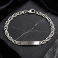 The rope chain id bracelet for men shown against a plain studio background