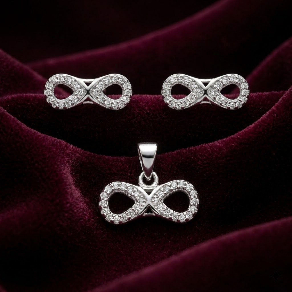 Silvme pure 925 sterling silver infinity pendant and stud earrings set with cubic zirconia, front view on white background
