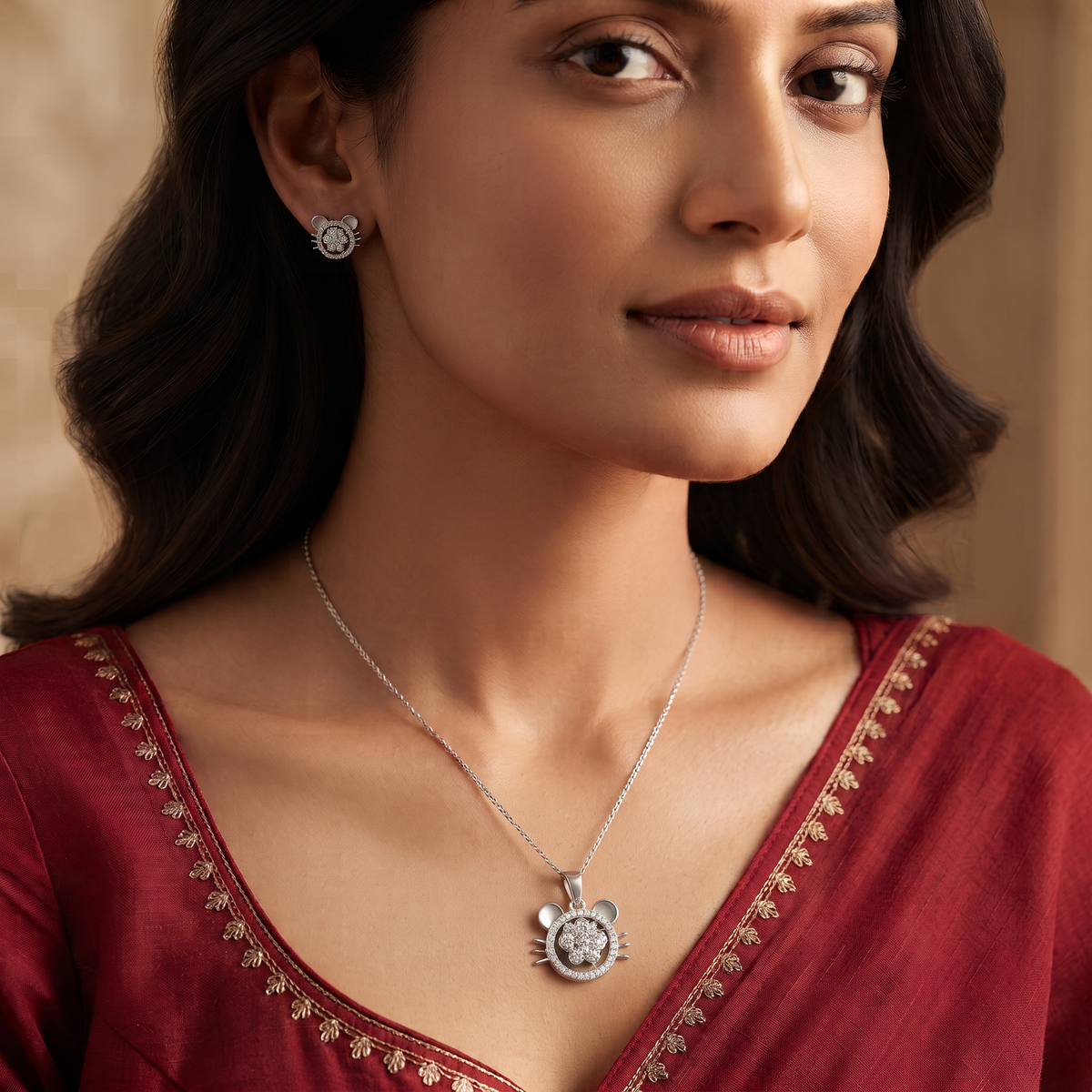 Cat face pendant worn at the neckline with a red festive outfit