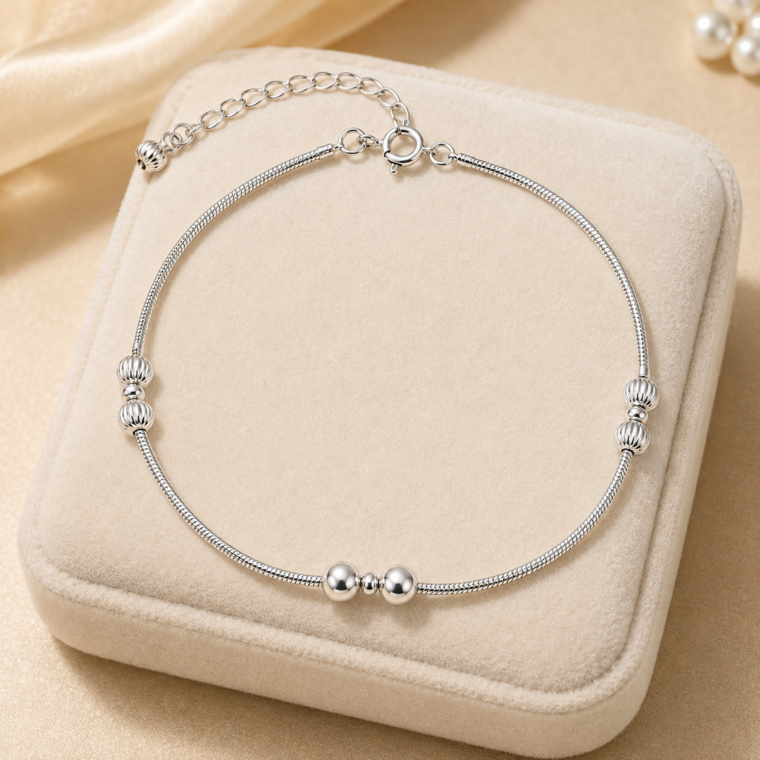 Silvme 925 sterling silver silver bead snake chain anklet with polished silver beads and a small fan charm, white background full view