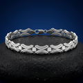 Full length of the open arc link bracelet showing its polished silver-tone finish