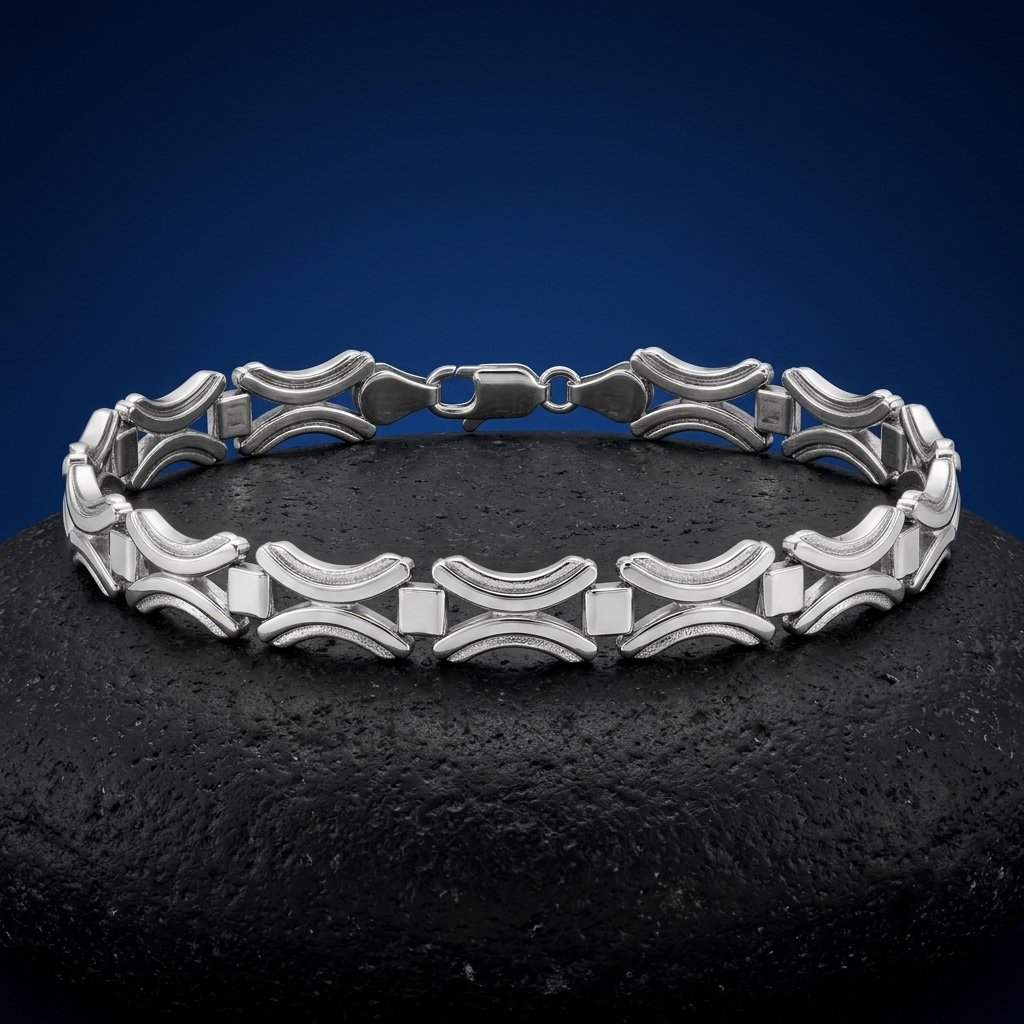Full length of the open arc link bracelet showing its polished silver-tone finish