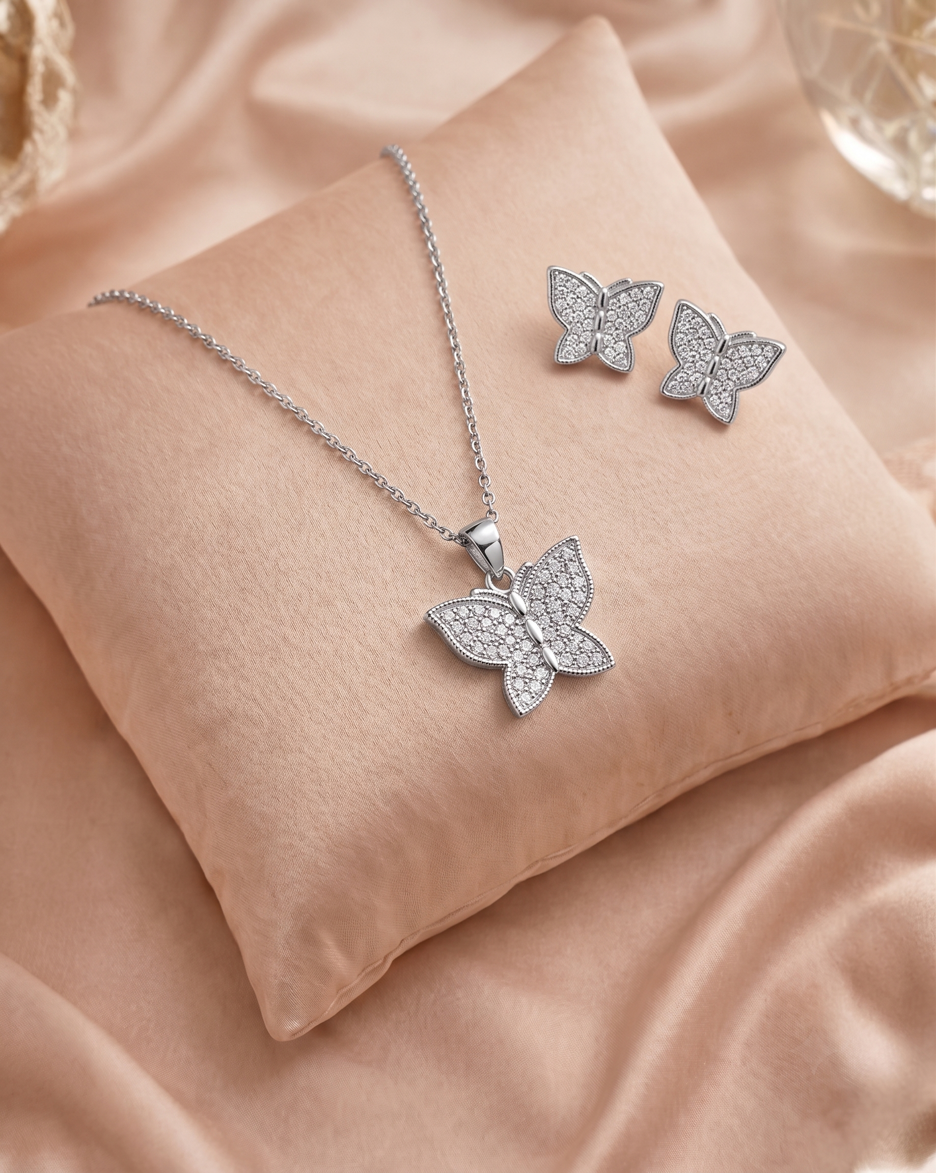 Butterfly 925 sterling silver pendant and stud earrings jewellery set with cubic zirconia by Silvme â€” gift styling view
