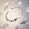 Full length of the rope chain id bracelet showing its polished silver-tone finish