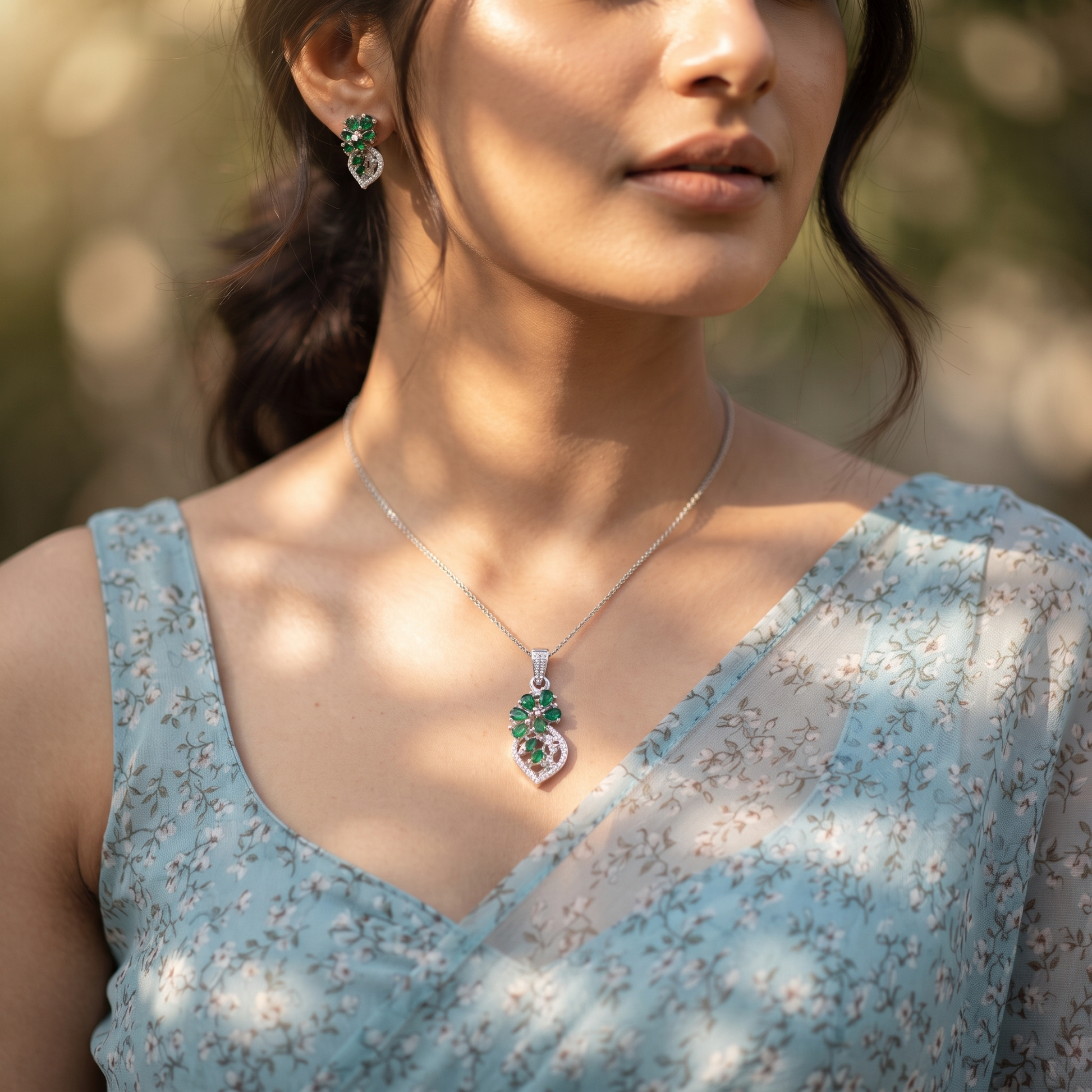 Silvme pure 925 sterling silver green floral pendant and stud earrings set with green cubic zirconia, styled lifestyle image