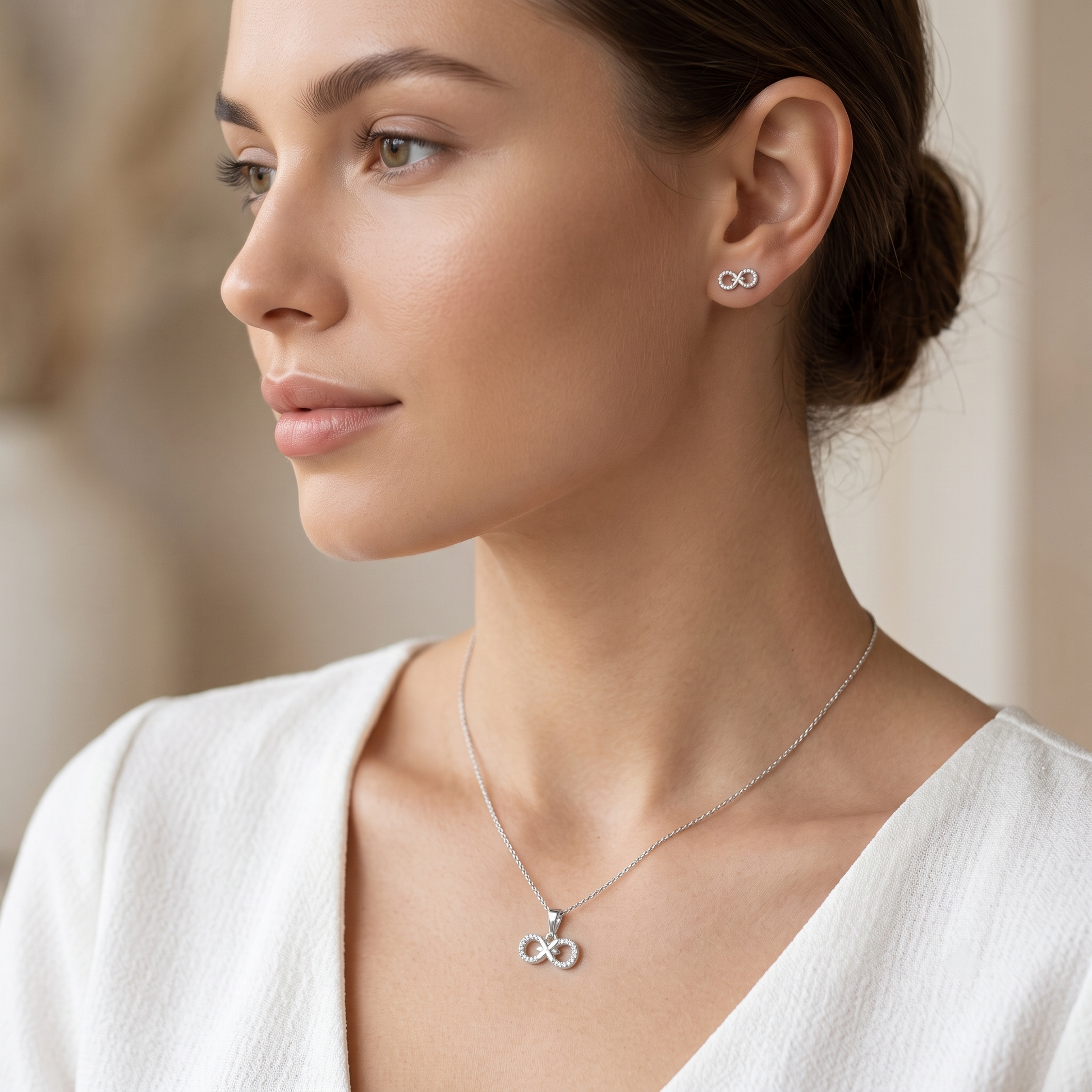 Silvme pure 925 sterling silver ribbon bow pendant and stud earrings set with cubic zirconia, styled product image