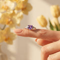Silvme purple oval stone halo silver ring for women worn paired with minimal silver bands on the hand