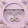 Silvme 925 silver infinity pendant and stud earrings with cubic zirconia, close-up detail