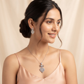 Silvme pure 925 sterling silver kite cluster pendant necklace and drop earrings set with cubic zirconia, styled flatlay view