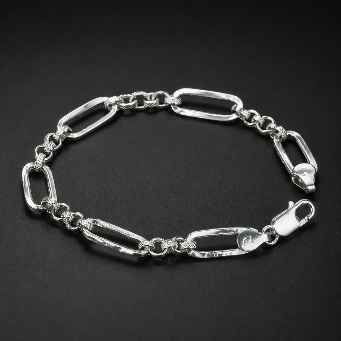 Silvme 925 sterling silver paperclip and round link bracelet for men shaped into an oval on a white background